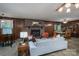 Spacious living room with fireplace, wood paneling, and access to dining area at 5635 Highway 55 E Hwy, Clover, SC 29710