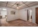 Cozy living room with carpet, paneled ceiling, and doorway views of the bathroom at 5635 Highway 55 E Hwy, Clover, SC 29710
