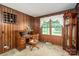 Cozy office space featuring classic wood paneling, a vintage desk, and a grandfather clock at 5635 Highway 55 E Hwy, Clover, SC 29710