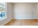 A bright room featuring hardwood floors, neutral walls, natural lighting, and windows at 608 Banter Ln # 31, Cramerton, NC 28032
