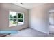 Cozy bedroom with a large window and neutral carpeting at 608 Banter Ln # 31, Cramerton, NC 28032