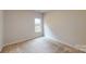 Carpeted bedroom with natural light from window overlooking the neighborhood at 608 Banter Ln # 31, Cramerton, NC 28032