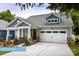 Charming home featuring stone accents, a two-car garage, and a welcoming front porch at 608 Banter Ln # 31, Cramerton, NC 28032