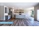 Open-concept kitchen with gray cabinets, a center island, and modern appliances at 608 Banter Ln # 31, Cramerton, NC 28032