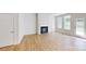 Spacious living room features a cozy fireplace, light hardwood floors, and natural light at 608 Banter Ln # 31, Cramerton, NC 28032