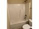 Classic bathroom features a neutral bathtub with shower combination, toilet, and tile floor at 6130 Sid Crane Dr, Charlotte, NC 28216