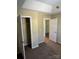 A walk-in closet with white shelving and neutral walls to maximize your storage space at 6130 Sid Crane Dr, Charlotte, NC 28216