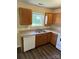 Efficient kitchen featuring wooden cabinets, laminate countertops, and a double sink at 6130 Sid Crane Dr, Charlotte, NC 28216