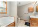 Bathroom featuring combination shower and tub, tile floors, and neutral paint at 614 W Peeler St, Salisbury, NC 28146