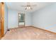 Bedroom featuring carpet, neutral paint, and window with natural light at 614 W Peeler St, Salisbury, NC 28146