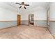 Generously sized bedroom offers carpet, neutral paint, ceiling fan, and ensuite bathroom access at 614 W Peeler St, Salisbury, NC 28146