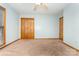 Spacious bedroom with neutral walls, plush carpet, and ample natural light at 614 W Peeler St, Salisbury, NC 28146