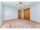 Cozy bedroom featuring neutral walls, plush carpet, and a ceiling fan for added comfort at 614 W Peeler St, Salisbury, NC 28146