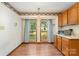 Breakfast nook with natural light from two windows, with a microwave oven and kitchen cabinets nearby at 614 W Peeler St, Salisbury, NC 28146