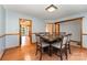 Dining room with wood floors, table and chairs, open to other rooms, perfect for gatherings at 614 W Peeler St, Salisbury, NC 28146