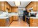 This kitchen is equipped with laminate countertops, wooden cabinets and black appliances at 614 W Peeler St, Salisbury, NC 28146