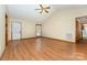 Bright living room with vaulted ceiling, wood-look floors, and a ceiling fan, creating a welcoming space at 614 W Peeler St, Salisbury, NC 28146