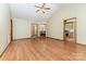 Spacious living area with wood-look floors and multiple doorways, providing easy access to other rooms at 614 W Peeler St, Salisbury, NC 28146