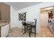 Eat-in kitchen with a breakfast nook and adjacent laundry area behind a closed door at 6811 Ledgestone Pl, Charlotte, NC 28227