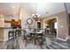 Charming dining room featuring views of the kitchen, office, gray floors, and abundant natural light at 6811 Ledgestone Pl, Charlotte, NC 28227