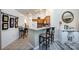 Bright kitchen and breakfast bar area with ample seating, barstools, and modern appliances at 6811 Ledgestone Pl, Charlotte, NC 28227