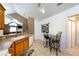Open eat-in kitchen boasts ample counter space and a breakfast nook with decorative wall hangings at 6811 Ledgestone Pl, Charlotte, NC 28227