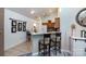 Bright kitchen and breakfast bar area with ample seating, barstools, and modern appliances at 6811 Ledgestone Pl, Charlotte, NC 28227