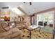 Spacious living room featuring comfortable seating, vaulted ceilings, and an open layout perfect for gatherings at 6811 Ledgestone Pl, Charlotte, NC 28227
