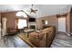 Comfortable living room with vaulted ceilings, a fireplace, and neutral decor creating a cozy atmosphere at 6811 Ledgestone Pl, Charlotte, NC 28227
