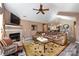 Cozy living room featuring a fireplace, plush seating, and an open layout for easy entertaining at 6811 Ledgestone Pl, Charlotte, NC 28227