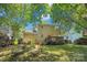 Backyard featuring a grassy yard, lounge chairs, and a deck on the home at 7217 Rena Mae Ln, Charlotte, NC 28227