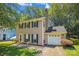 Charming two-story home with a brick chimney, attached garage, and well-maintained lawn at 7217 Rena Mae Ln, Charlotte, NC 28227