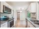 Modern kitchen featuring stainless steel appliances and granite countertops at 7217 Rena Mae Ln, Charlotte, NC 28227