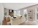 Bright living room featuring a brick fireplace and neutral furniture at 7217 Rena Mae Ln, Charlotte, NC 28227