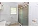 Bathroom featuring a glass-enclosed shower, toilet, and sink at 801 Fugate Ave, Charlotte, NC 28205