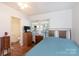 Bright bedroom featuring hardwood floors, a window with blinds, and neutral paint at 801 Fugate Ave, Charlotte, NC 28205
