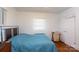 Bright bedroom with hardwood floors, white walls and a window at 801 Fugate Ave, Charlotte, NC 28205