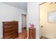 Hallway view with wood flooring and a small table near the open doorway at 801 Fugate Ave, Charlotte, NC 28205