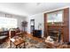 Living room with brick fireplace and hardwood floors at 801 Fugate Ave, Charlotte, NC 28205