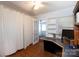 Office area with built-in shelving and wood floors at 801 Fugate Ave, Charlotte, NC 28205