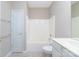 White bathroom features a tub and shower combination and a vanity with sink at 8409 Darcy Hopkins Dr, Charlotte, NC 28277