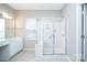 Bright primary bathroom featuring glass shower and vanity with great lighting at 8409 Darcy Hopkins Dr, Charlotte, NC 28277