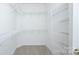 A spacious walk-in closet with multiple wire shelves for optimal storage and organization at 8409 Darcy Hopkins Dr, Charlotte, NC 28277