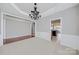Open dining room with hardwood floors visible leading into the kitchen at 8409 Darcy Hopkins Dr, Charlotte, NC 28277