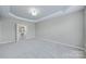 Spacious main bedroom with neutral walls and adjoining bathroom at 8409 Darcy Hopkins Dr, Charlotte, NC 28277