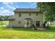 Exterior view of a home with a large backyard, patio, and grassy area at 920 Manor Dr, Kings Mountain, NC 28086