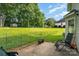 Backyard with a patio, lawn, trees, and a storage shed at 920 Manor Dr, Kings Mountain, NC 28086