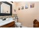 Stylish half-bathroom featuring artistic decor, and neutral colors, perfect for guests and everyday convenience at 920 Manor Dr, Kings Mountain, NC 28086