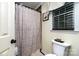 Bathroom featuring a shower with curtain, toilet, and window at 920 Manor Dr, Kings Mountain, NC 28086