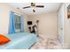 Cozy bedroom with a ceiling fan, window, and personal exercise bike at 920 Manor Dr, Kings Mountain, NC 28086